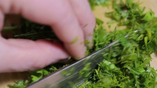 A Woman Grinds Knife Green