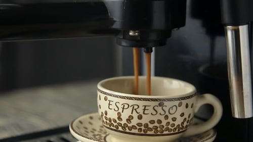Espresso Brewing into Decorative Mug