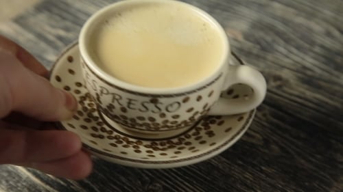 Steaming Espresso Cup Placed on Rustic Wooden Table