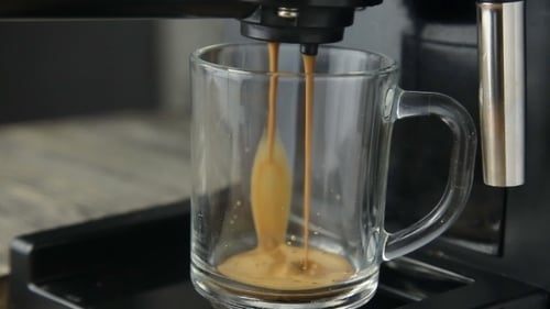 Espresso Pouring into Clear Glass Mug