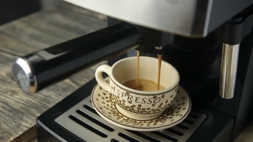 Espresso Pours From Machine Into Mug