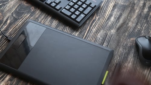 Graphic Tablet Use on Desk with Coffee and Keyboard