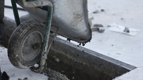 Worker Pouring Concrete From Truck