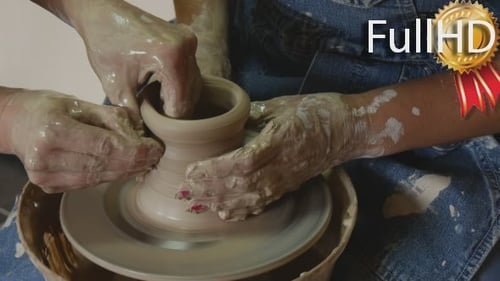 Hands Shaping Clay on Pottery Wheel