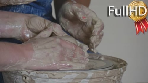 Hands Shaping Clay on Pottery Wheel