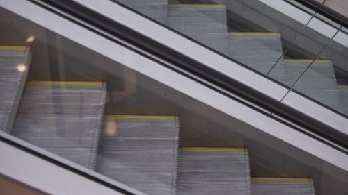 Escalator Going Up in Gray and Yellow