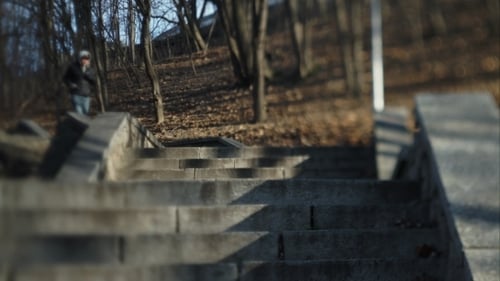 A Man Running Up The Stairs To The Street