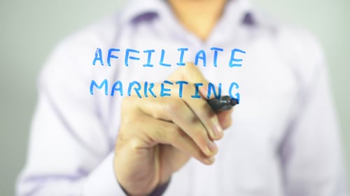 Man Writes Affiliate Marketing on Clear Surface
