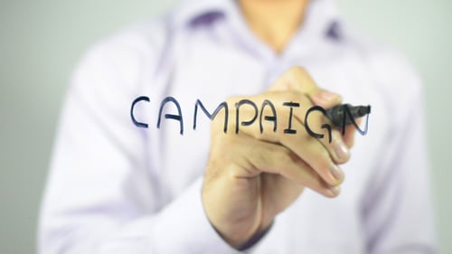 Writing Campaign With a Marker on Clear Wall