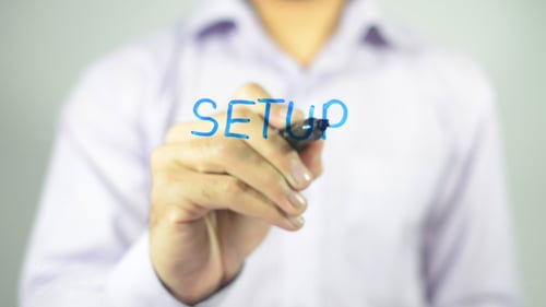 Writing Setup with Blue Marker on Clear Surface