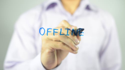 Person Writing Offline with a Blue Marker