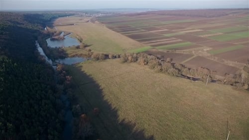 Aerial View of Countryside with River and Fields