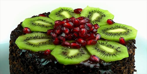 Delicious Chocolate Cake Topped with Kiwi and Pomegranate