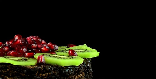 Rotating Chocolate Cake with Kiwi and Pomegranate Seeds