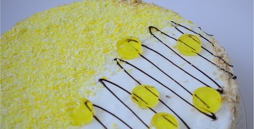 Decorated Cake with Yellow Sprinkles and Drizzle
