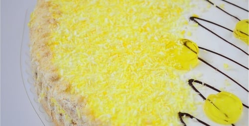 Decorated Birthday Cake with Yellow Sprinkles and Candy