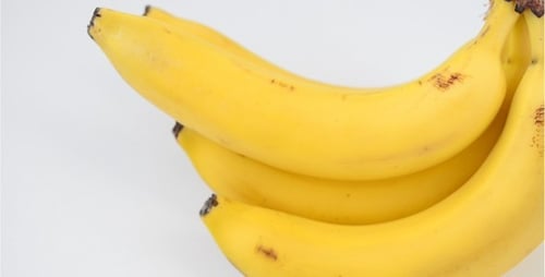 Ripe Yellow Bananas Rotating on a White Background