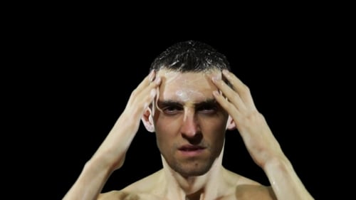 Young Man Washing Hair With Shampoo.