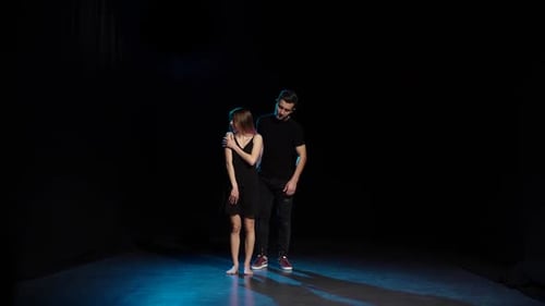Romantic Choreography Against Black Background in Spotlight at Studio, Slow Motion.