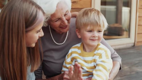 Grandmother With Grandchildren Together Outside