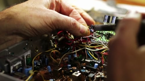 Expert Hands Soldering Intricate Electronic Circuit Board Components