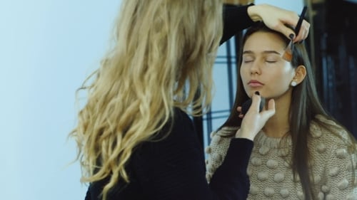 Make-Up Artist Applying Make-Up to Young Woman