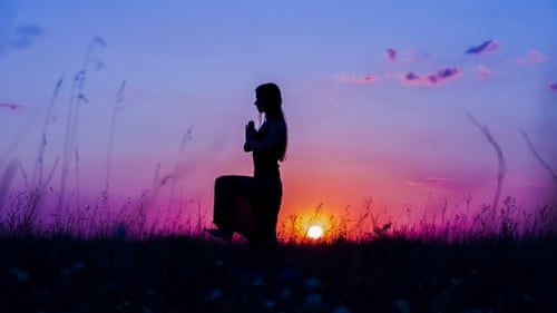Woman Silhouette Practicing Yoga at Colorful Sunset