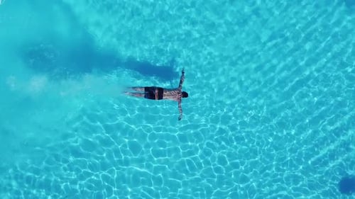 Man Diving Into Swimming Pool