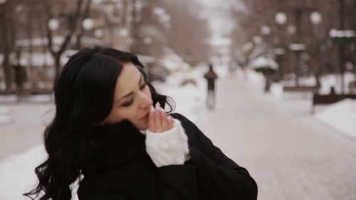 Beautiful Girl In The Winter Park Warms Cold Hands