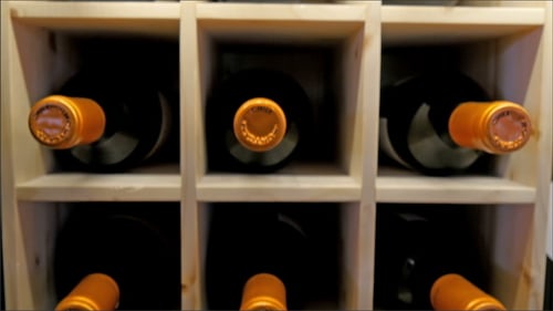 Wine Bottles Stored in a Wooden Wine Rack