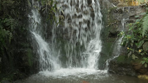 Rushing Waterfall Cascading Over Rocks