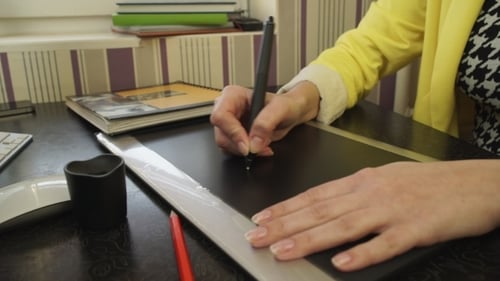 Designer Drawing on Tablet with Stylus Close Up