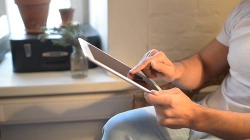 Adult Using Tablet Device in Home Setting