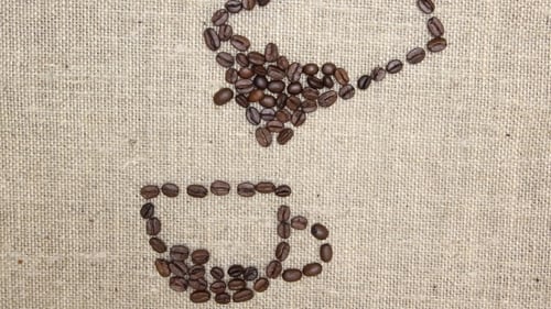 Coffee Beans Forming Abstract Cup on Burlap