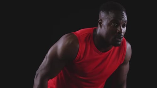 Muscular Man Running in a Red Tank Top