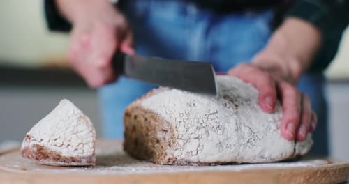 Slicing Fresh Homemade Bread with Knife