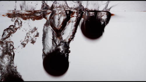 Tomatoes Dropped into Water