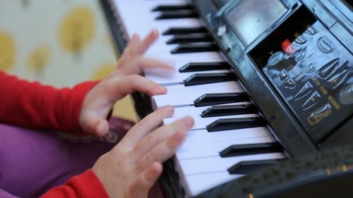 Child Plays Small Keyboard