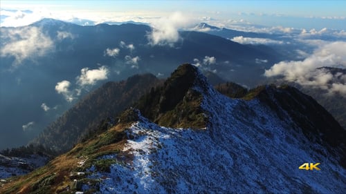 Aerial First Snow on Mountain Ridge
