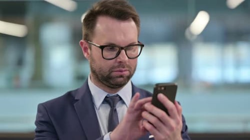 Man in Suit Using Mobile Phone Close Up