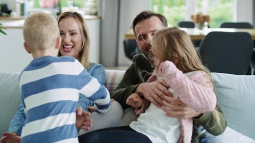 Loving Family Relaxing Together on Couch