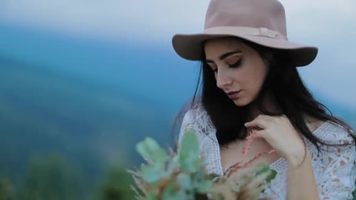 Elegant stylish bride. Portrait of bride posing against mountain