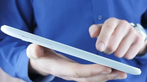 Person Using Tablet Close Up