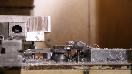 Metal Cutting Machine Sprays Fluid While Shaping Material