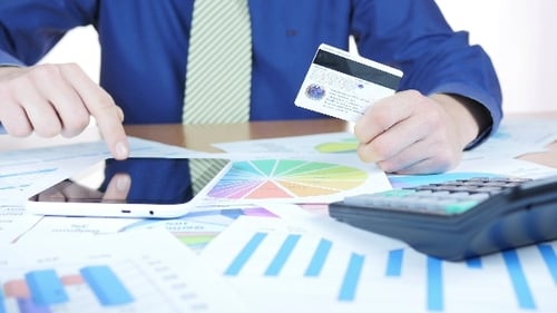 Adult Enters Credit Card on Tablet Close Up