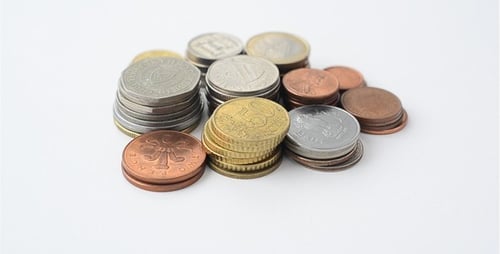 Piles of Coins on White Background