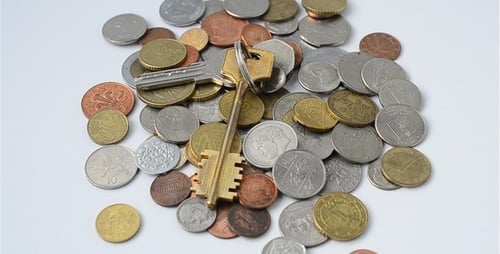 A Pile of International Coins and Keys