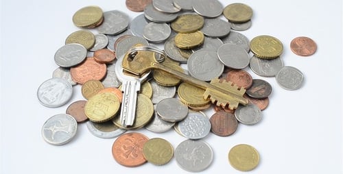 Colorful Coins and Keys on White Background