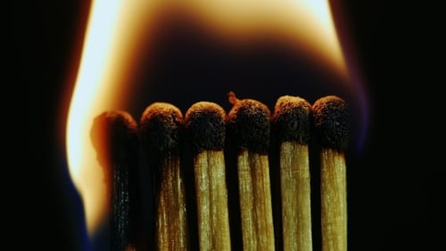 Igniting Matches Burning Down Macro Close-Up Black Background