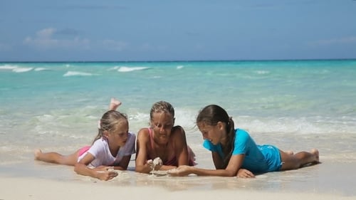 Happy Family Playing On The Beach At The Day Time